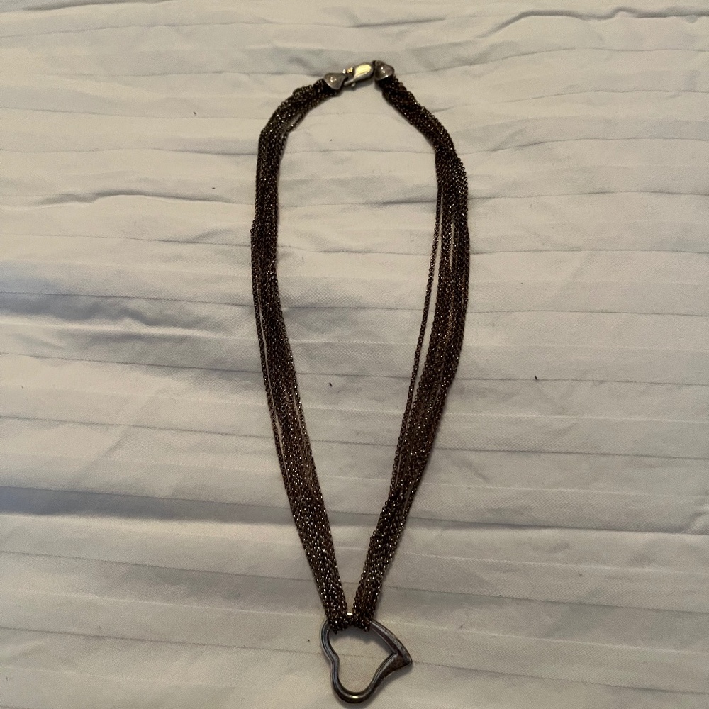 Multi-strand silver necklace with silver heart pendant
